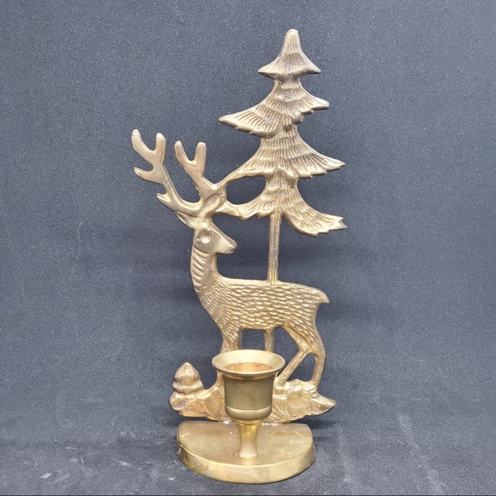 This is a vintage solid brass candleholder of deer